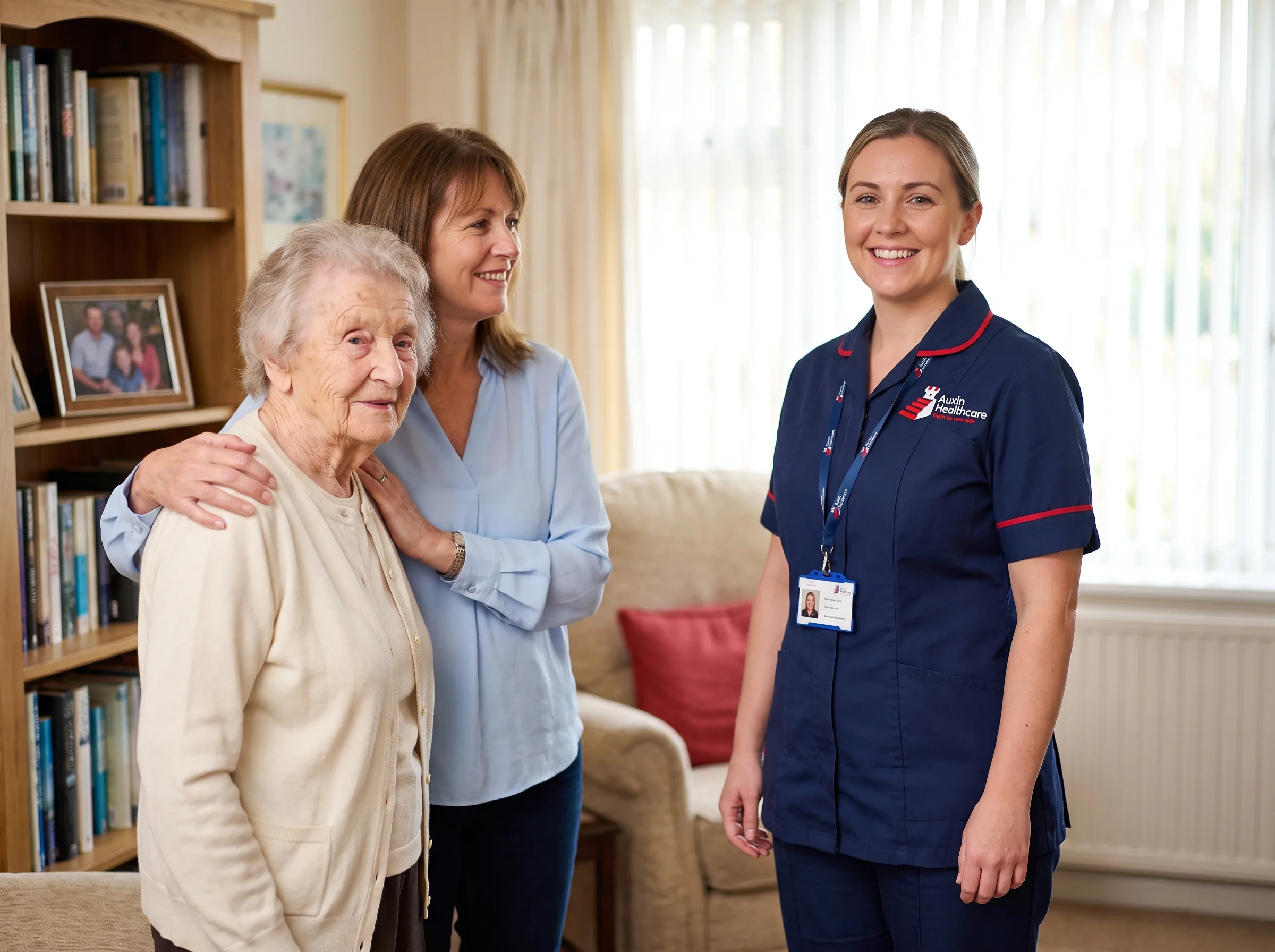 Auxin carer with an older woman and her daughter at home, showing family trust in Spalding home care