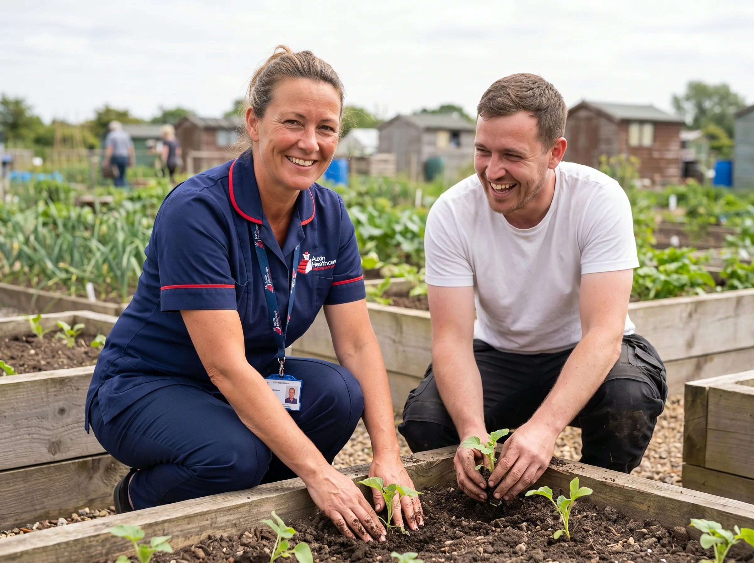 Auxin support worker volunteering with a man at a community garden, supporting mental health and wellbeing in Spalding