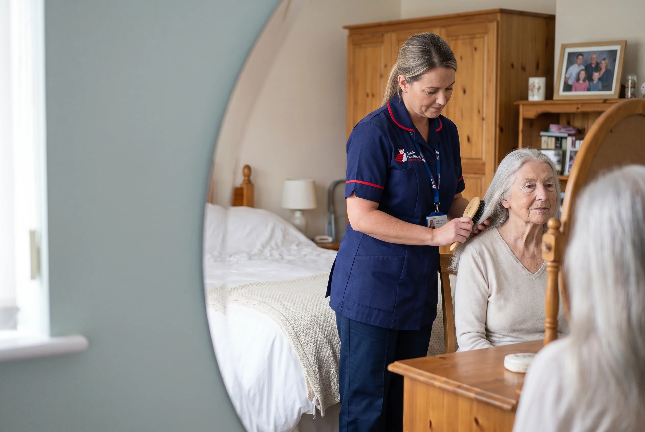 Auxin carer brushing an older woman's hair during a personal care visit at home in Spalding