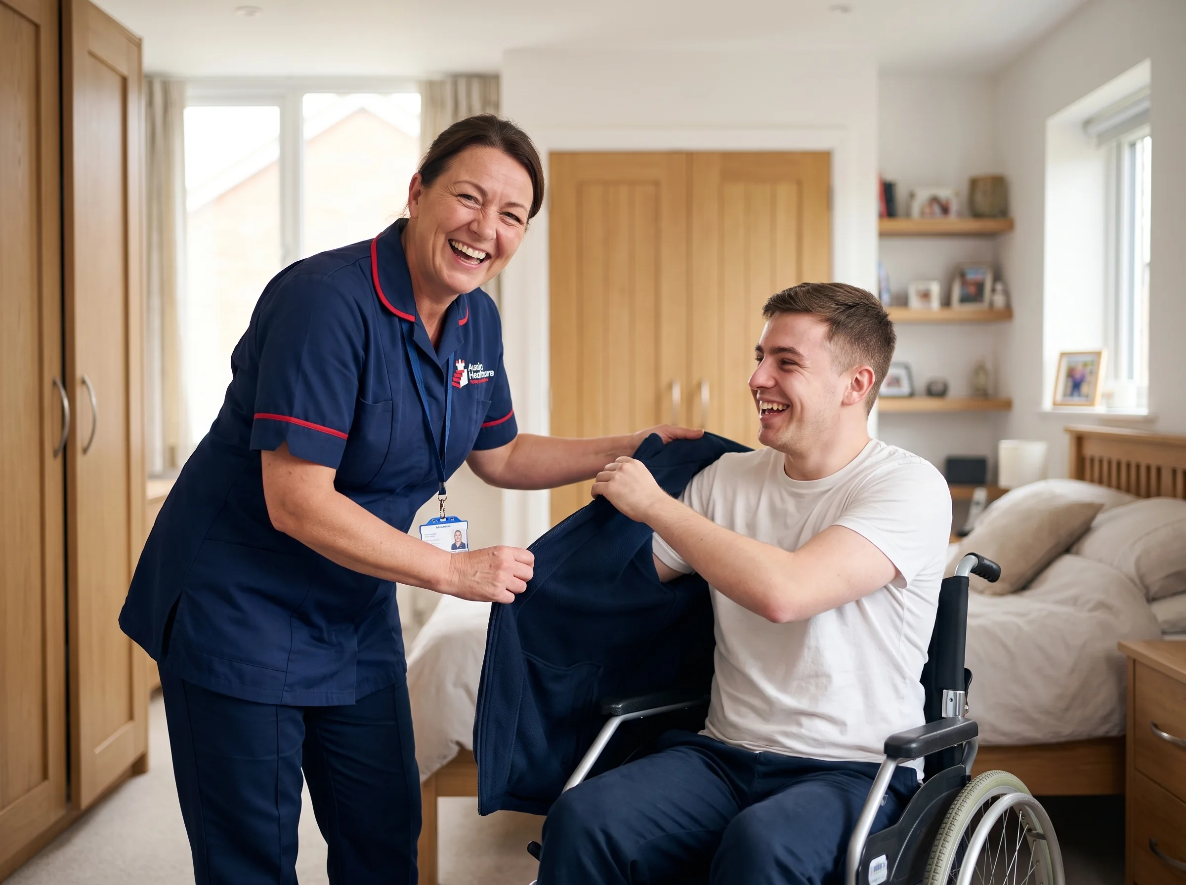 Auxin carer supporting a young man who uses a wheelchair to get ready for his day at home in Spalding