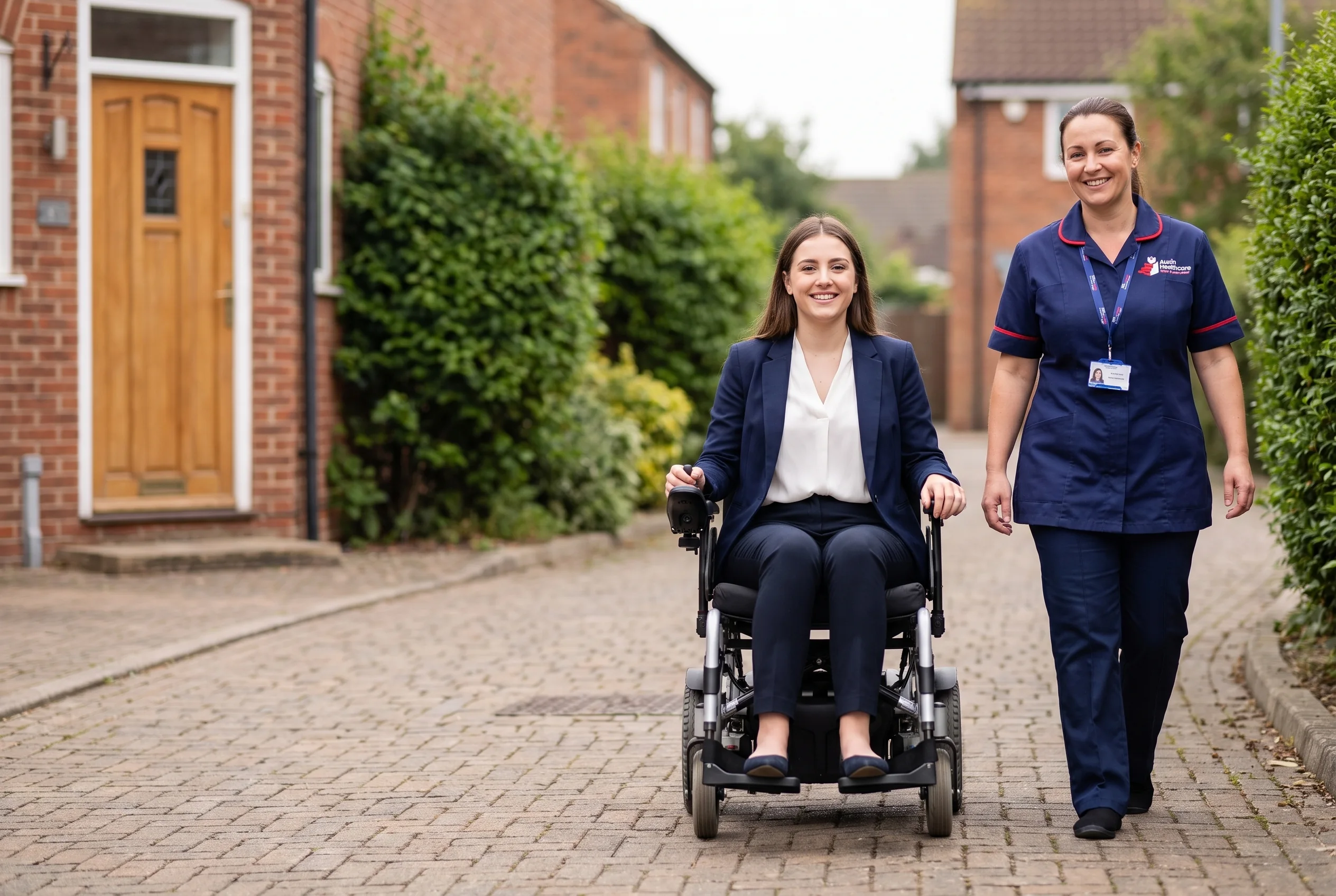 Auxin support worker walking with a young woman who uses a wheelchair as she leaves home for work in Spalding