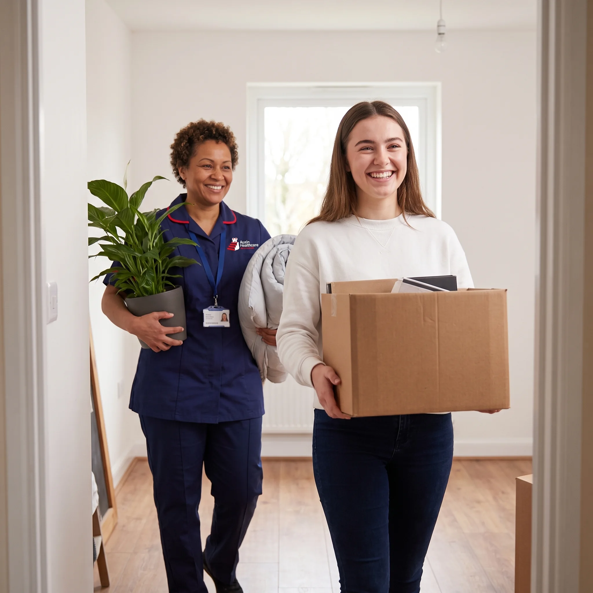 Young woman moving into her first flat with help from an Auxin support worker during transition to adult life