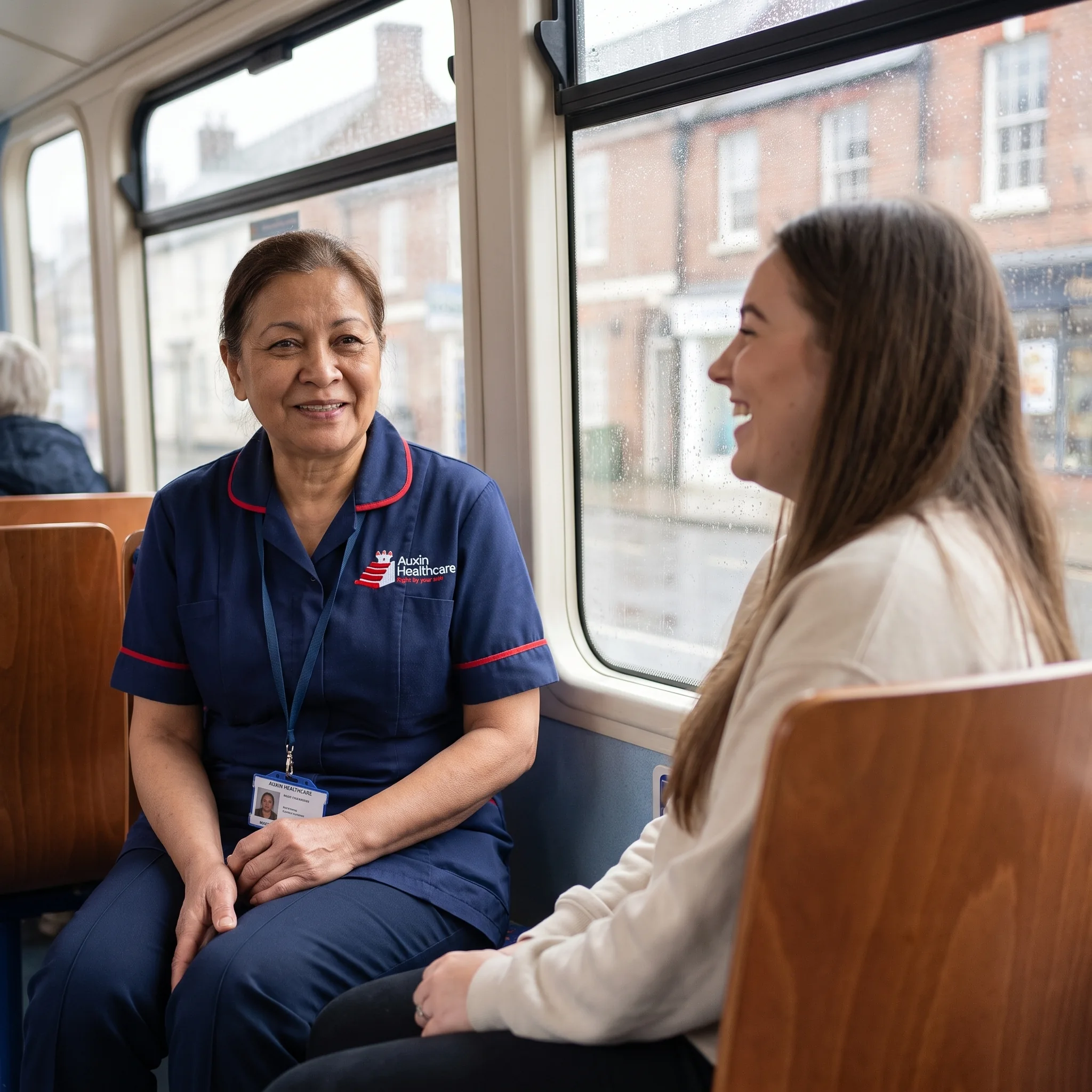Auxin support worker travelling by bus with a young woman from supported living on a trip into Spalding town