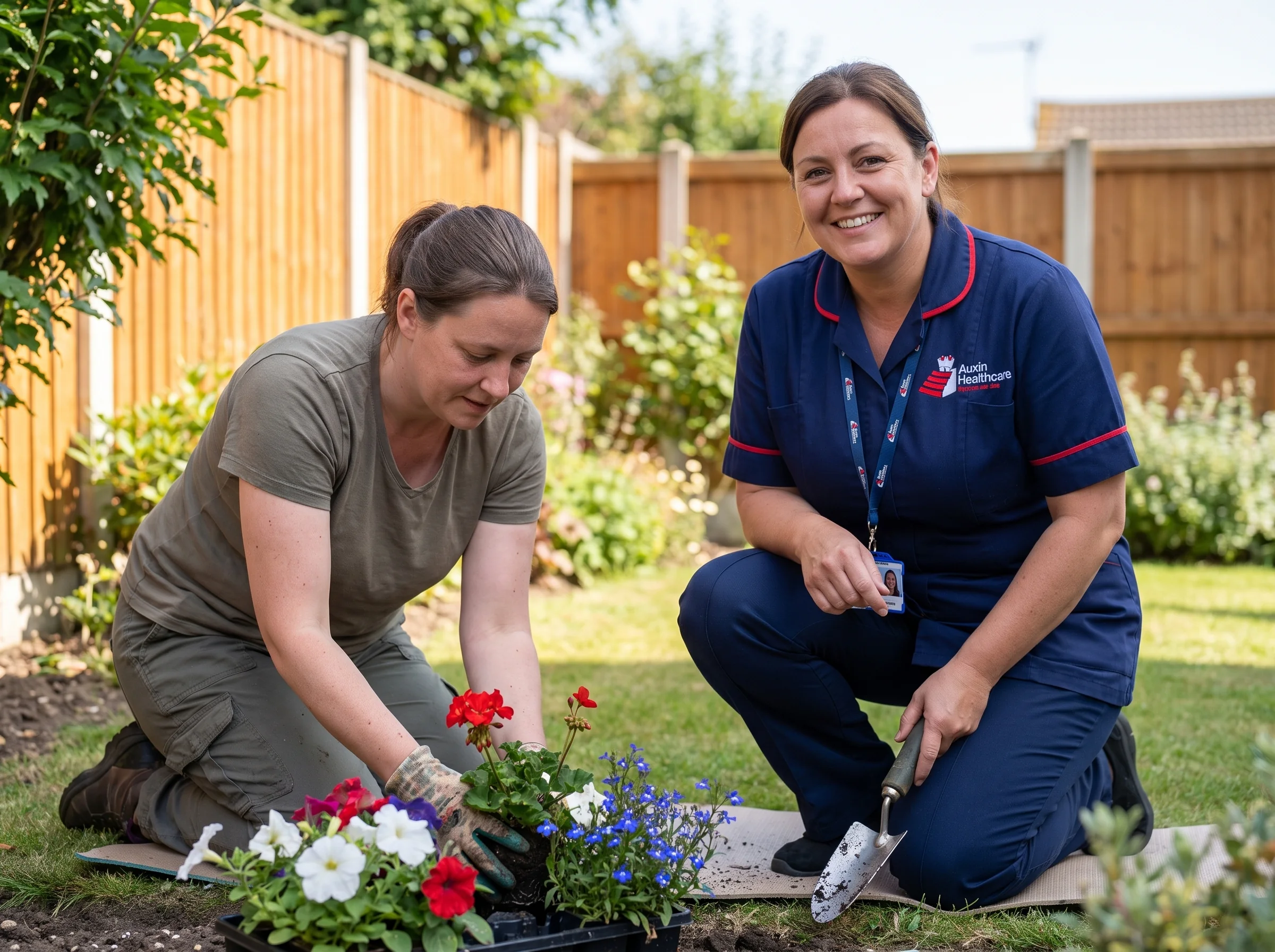 Tenant planting flowers in her supported living garden with an Auxin support worker in Lincolnshire